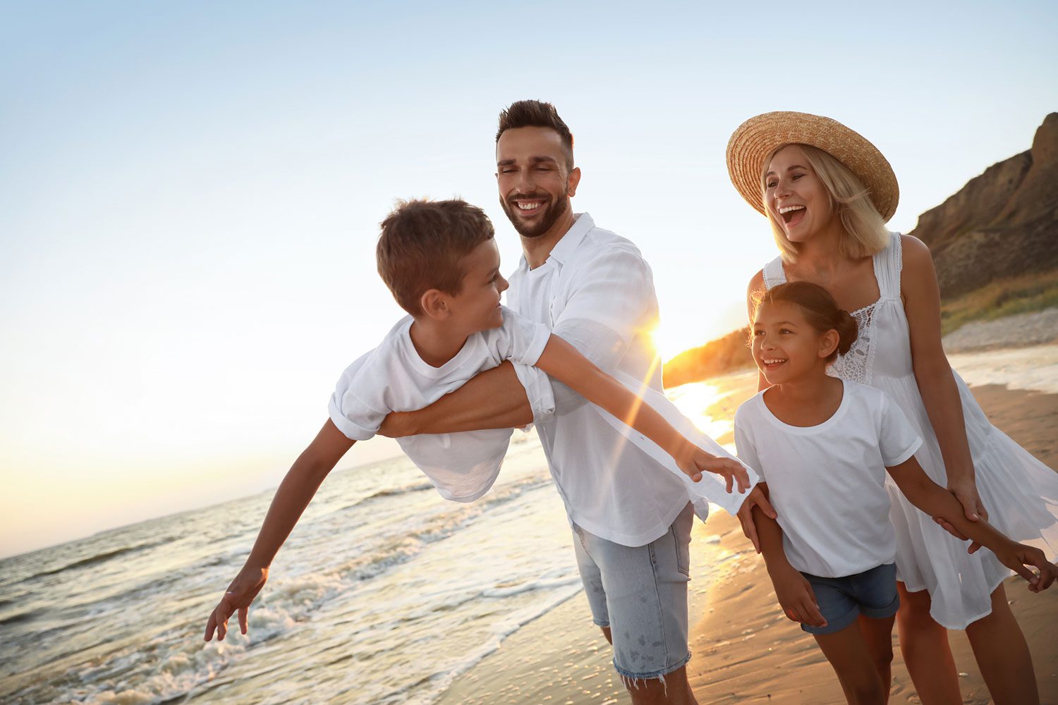 Featured image for American Forces Travel, showing a happy military family on vacation by the beach