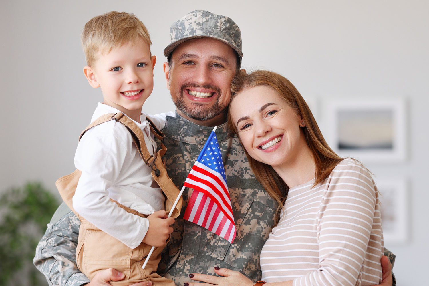 Featured image for Servicemembers Civil Relief Act – also called SCRA – showing a happy military family