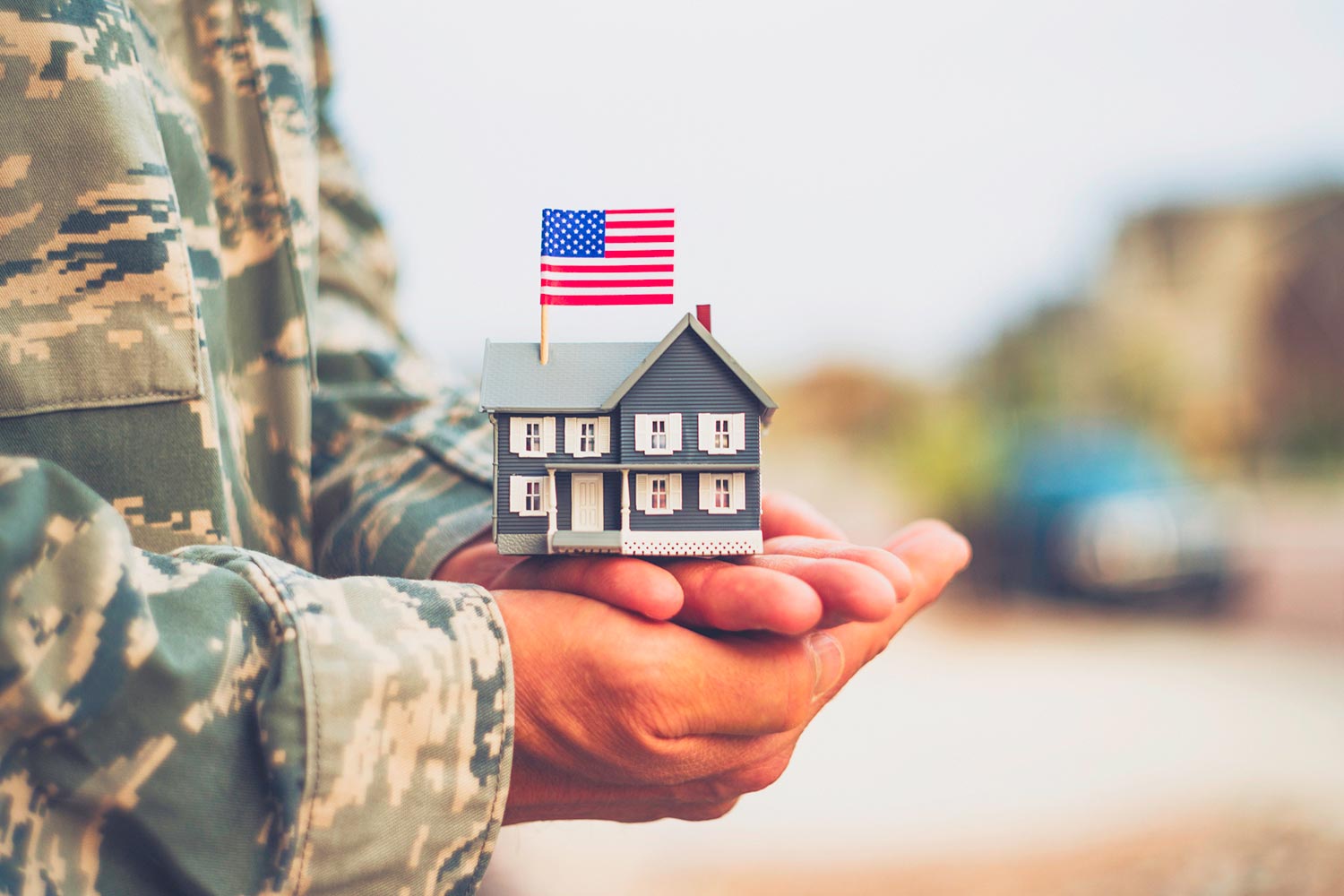 Featured image for VA Loan HELOC, showing a soldier holding a miniature model of a house